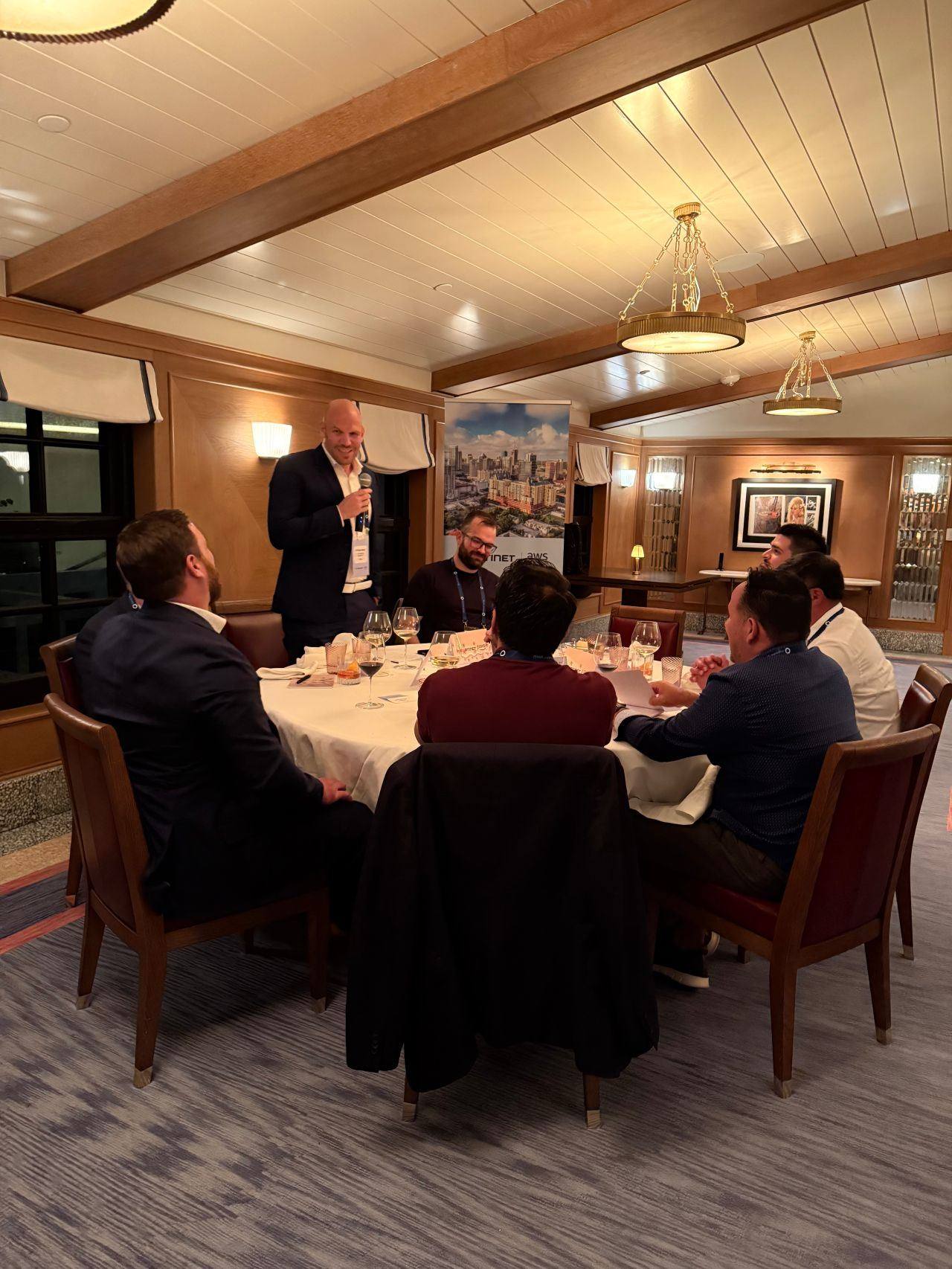 Christian Merkel speaking at AWS & Fortinet Senior Leadership Meetup on AI-Powered Resilience, The Surf Club Private, Fort Lauderdale